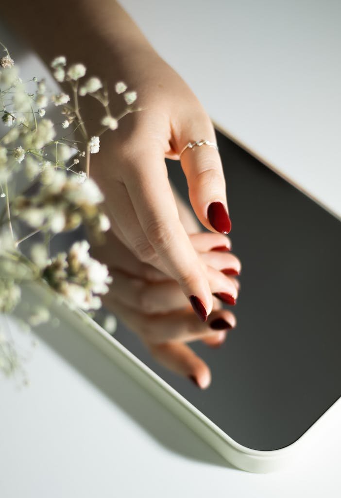 Red Nails Near Mirror